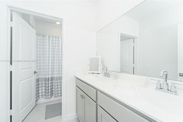 bathroom featuring tile patterned floors and vanity