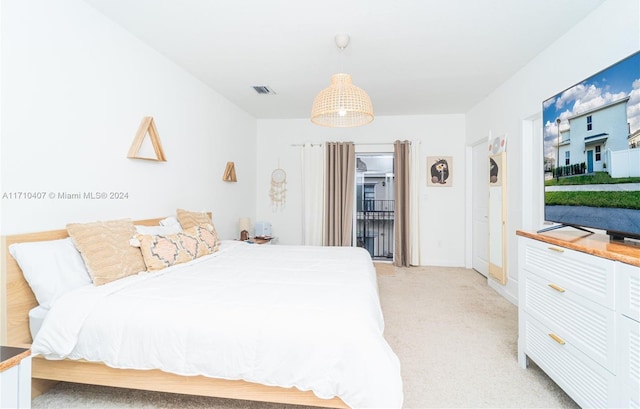 bedroom featuring light carpet