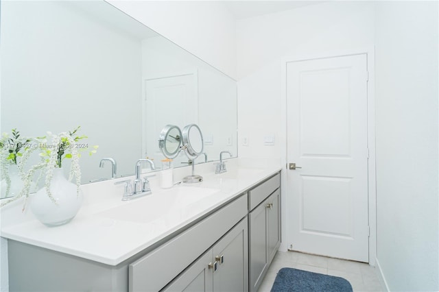 bathroom with tile patterned flooring and vanity