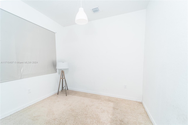 unfurnished room with carpet flooring