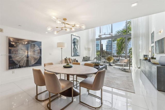 tiled dining space featuring floor to ceiling windows and a notable chandelier