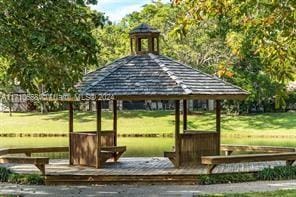 view of property's community featuring a gazebo and a lawn