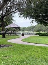 view of community with a gazebo and a lawn