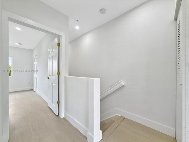 hallway with light wood-type flooring