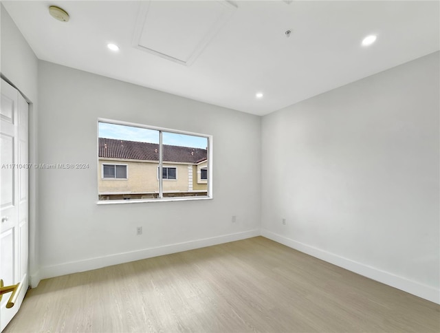 spare room with light wood-type flooring