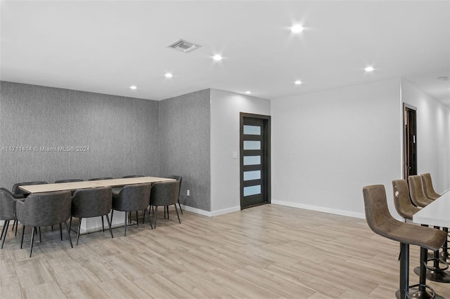 dining area with light hardwood / wood-style floors