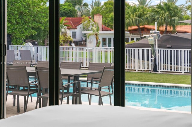 view of swimming pool with a patio area