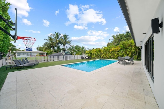 view of swimming pool with a patio area