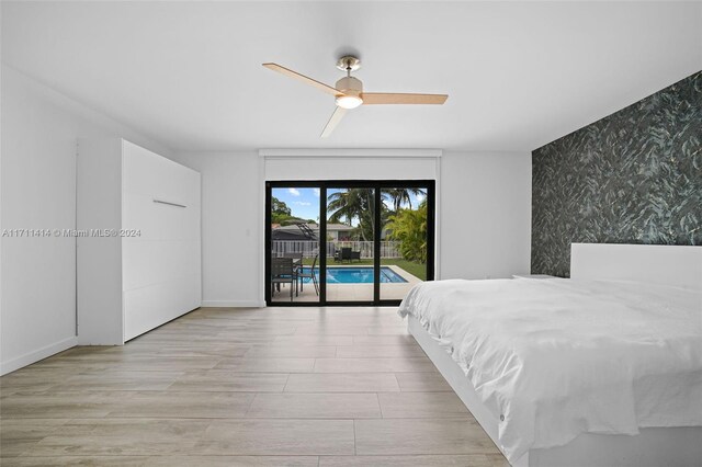 bedroom featuring access to outside, ceiling fan, and light wood-type flooring