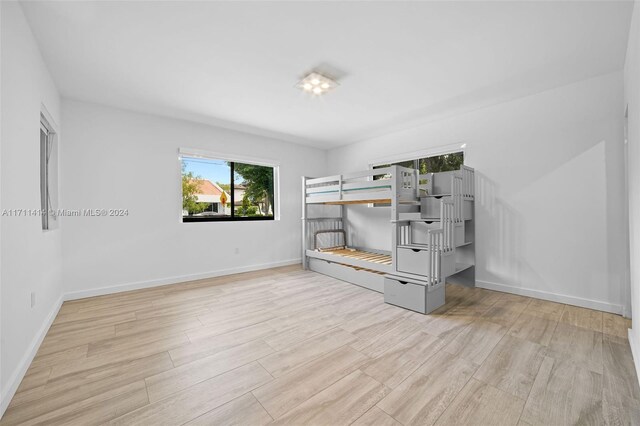 unfurnished bedroom with light hardwood / wood-style floors