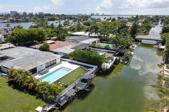 birds eye view of property featuring a water view