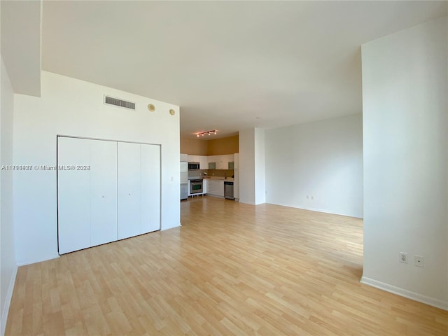 unfurnished living room featuring light hardwood / wood-style floors