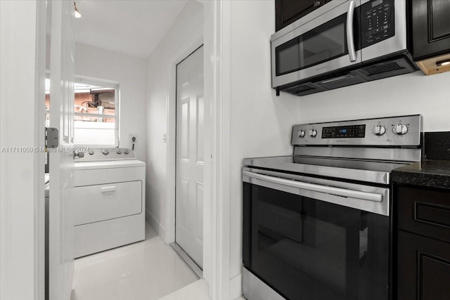 kitchen with washer / clothes dryer, light tile patterned floors, and appliances with stainless steel finishes