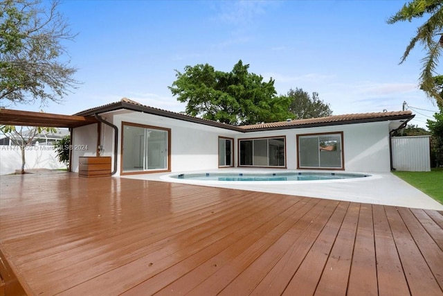 exterior space with a pool side deck