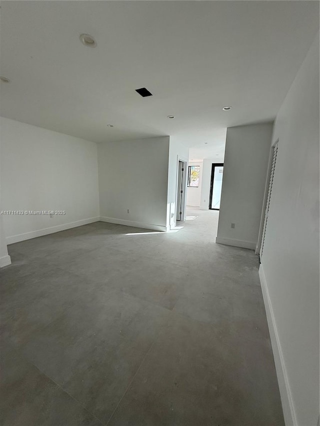 empty room featuring concrete floors