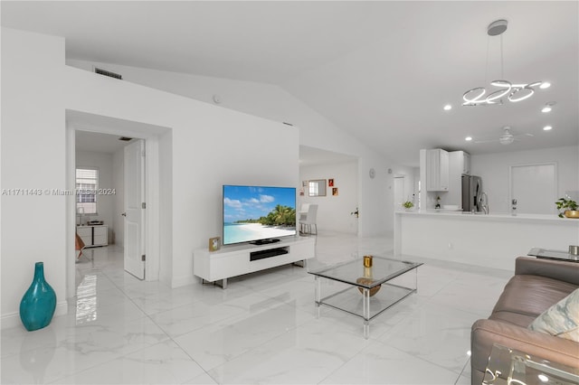 living room featuring lofted ceiling