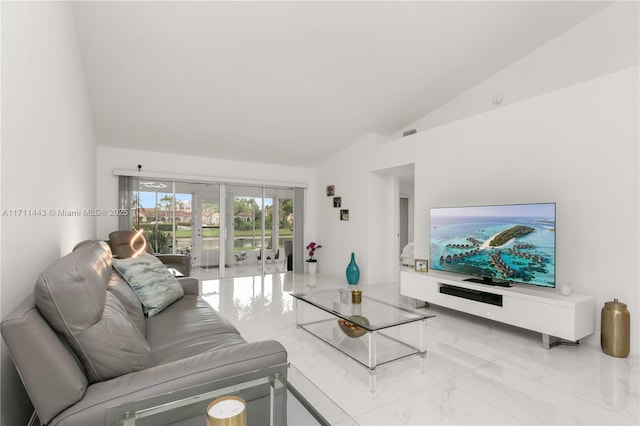 7584 Red Ruby Dr, Delray Beach, FL 33446 - living room featuring light marble finish floors and lofted ceiling