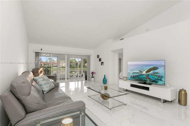 living room featuring vaulted ceiling