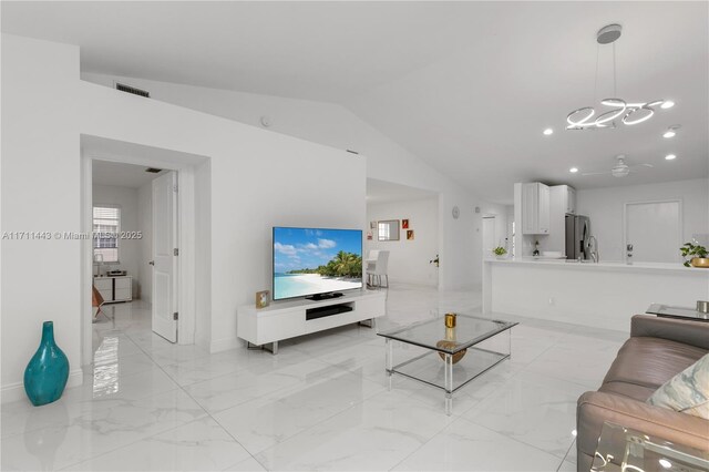 living room with visible vents, a ceiling fan, marble finish floor, vaulted ceiling, and recessed lighting