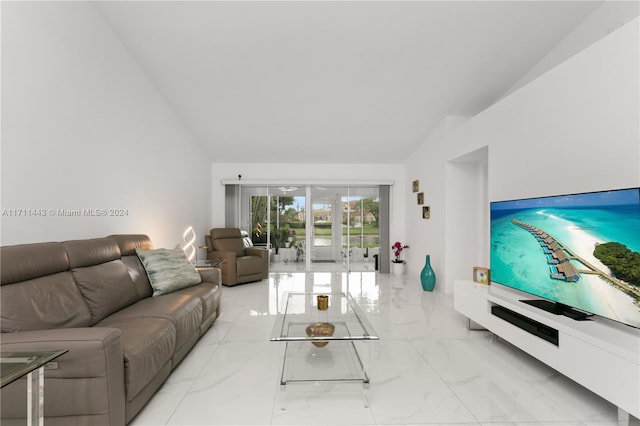 living room featuring lofted ceiling