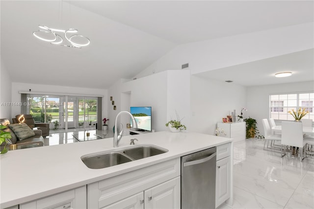 kitchen featuring stainless steel dishwasher, sink, white cabinets, hanging light fixtures, and lofted ceiling