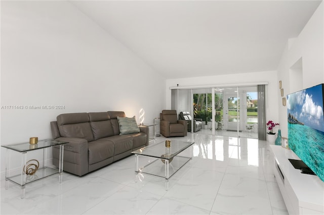 living room featuring vaulted ceiling