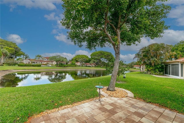 exterior space featuring a water view and a yard