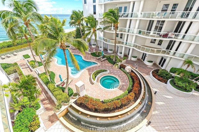 view of pool featuring a water view