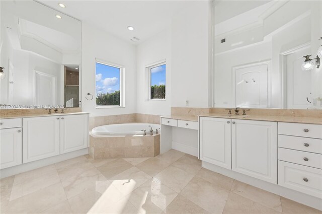 bathroom featuring vanity and shower with separate bathtub