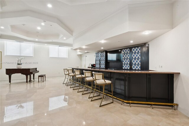 bar with a tray ceiling, ornamental molding, and pool table