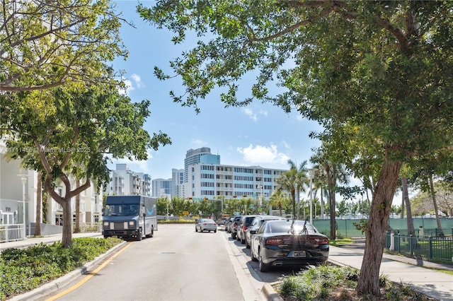 view of street with curbs and a city view