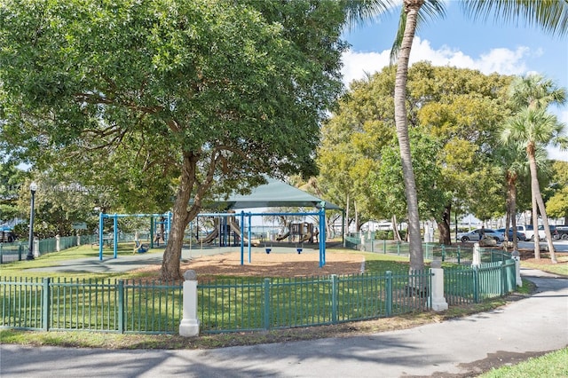 surrounding community featuring playground community and fence