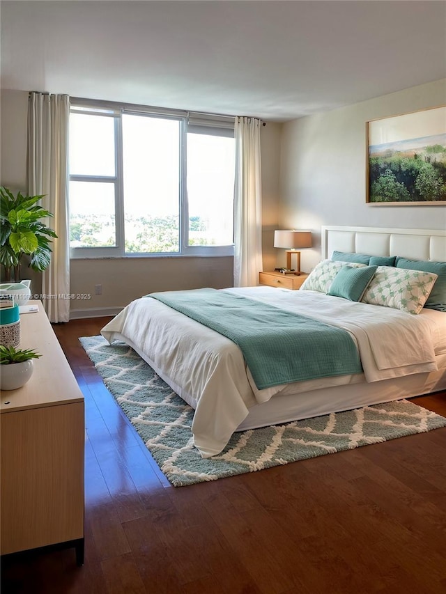 bedroom featuring dark wood-type flooring