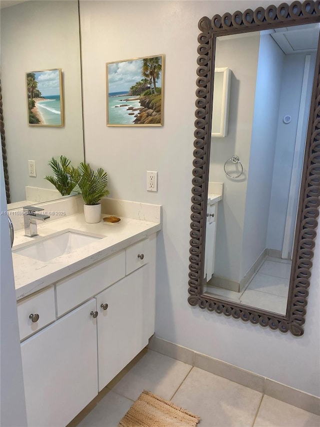 bathroom with tile patterned flooring and vanity