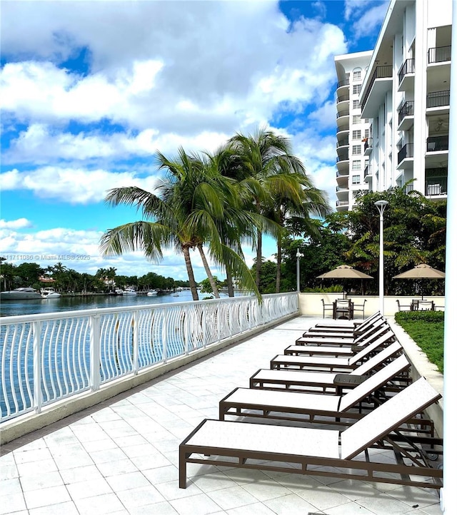 view of pool featuring a water view