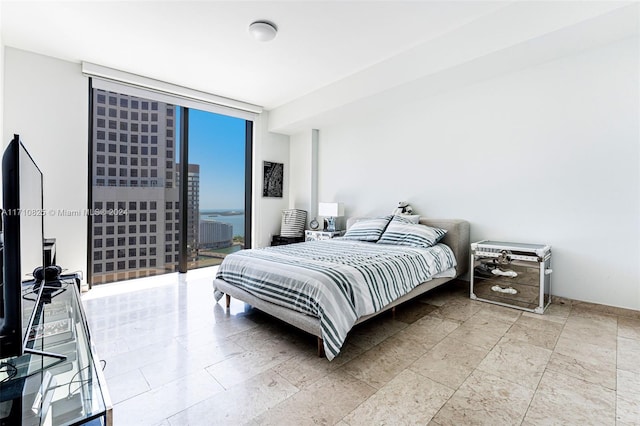 bedroom featuring floor to ceiling windows