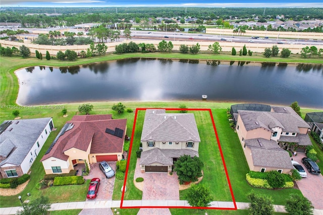 birds eye view of property featuring a water view