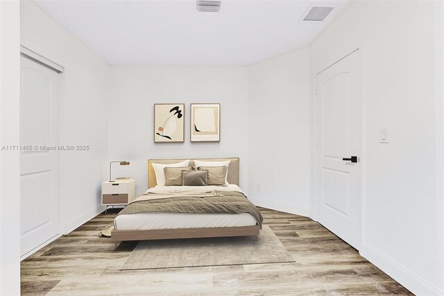 bedroom featuring hardwood / wood-style flooring