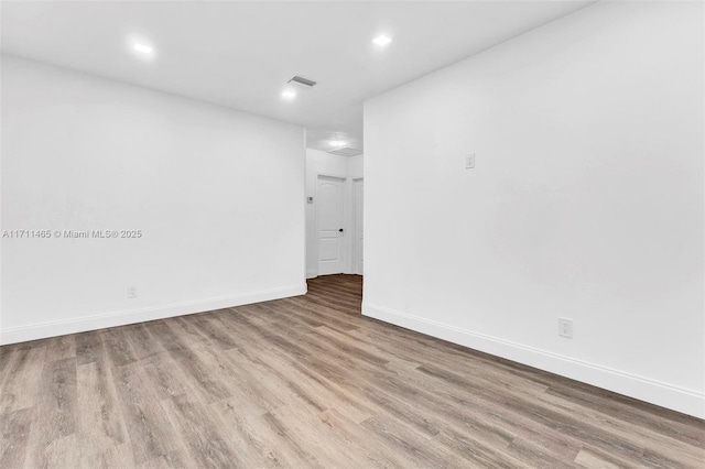 unfurnished room featuring light hardwood / wood-style floors