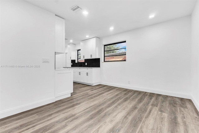 unfurnished living room featuring light hardwood / wood-style flooring