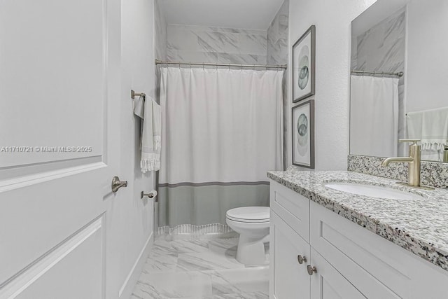 bathroom with toilet, vanity, and a shower with curtain