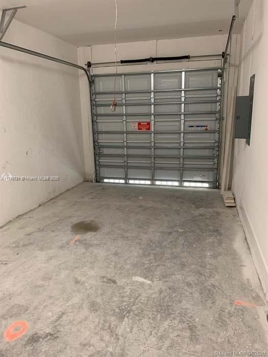 garage with electric panel