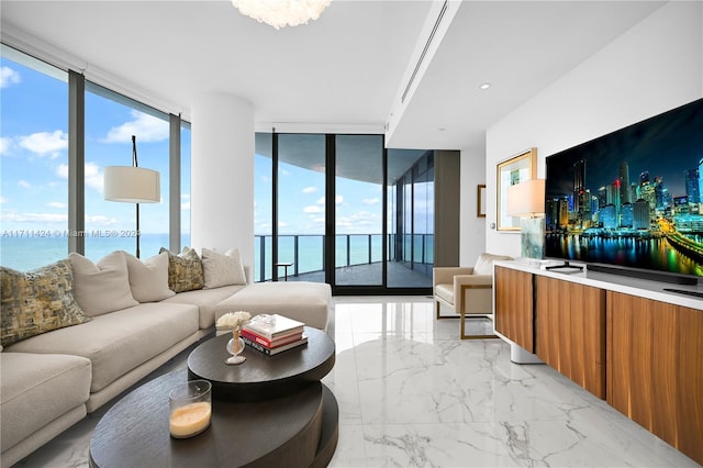 living room featuring a water view and expansive windows