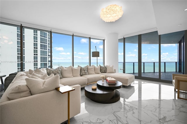 living room with a water view and floor to ceiling windows