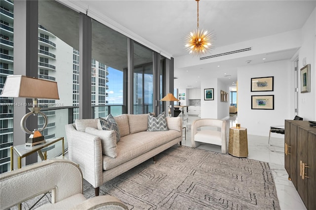 living room featuring floor to ceiling windows and a notable chandelier