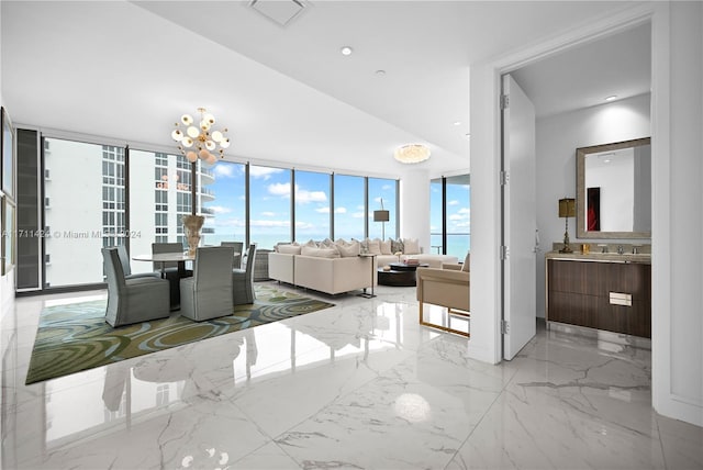 unfurnished dining area with floor to ceiling windows and an inviting chandelier