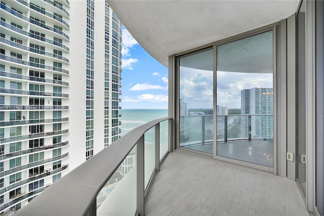 balcony featuring a water view