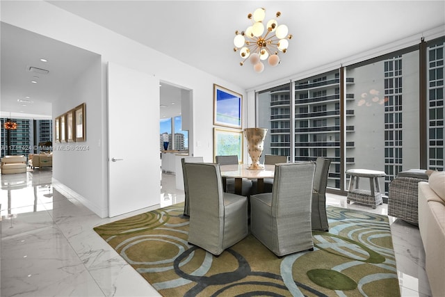 dining area with an inviting chandelier and expansive windows