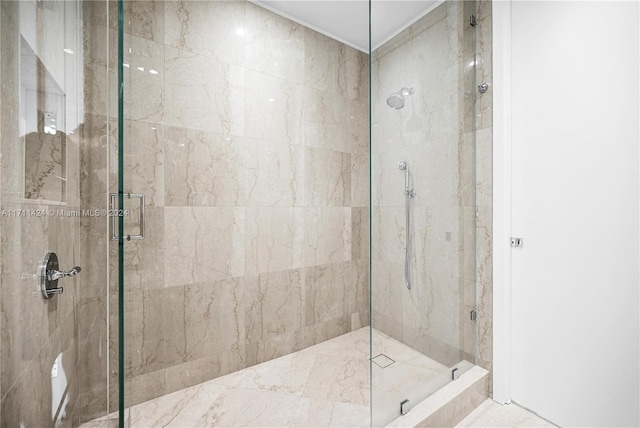 bathroom with a shower with shower door