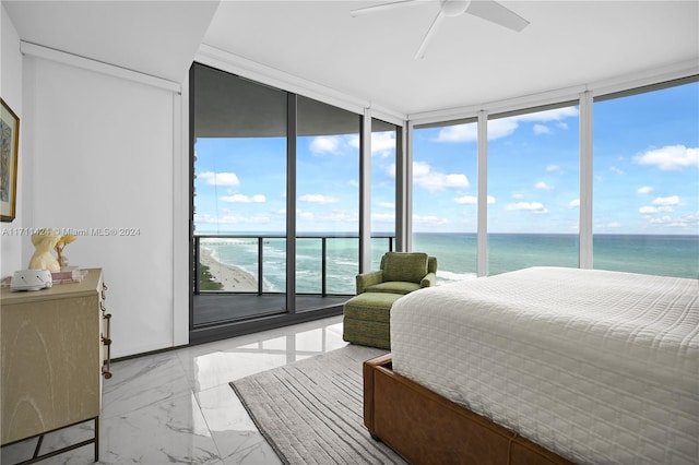 bedroom with floor to ceiling windows, a view of the beach, a water view, and ceiling fan